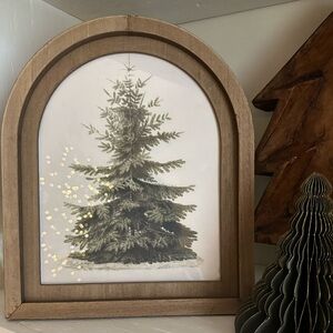 Arched Christmas art framed in wood frame